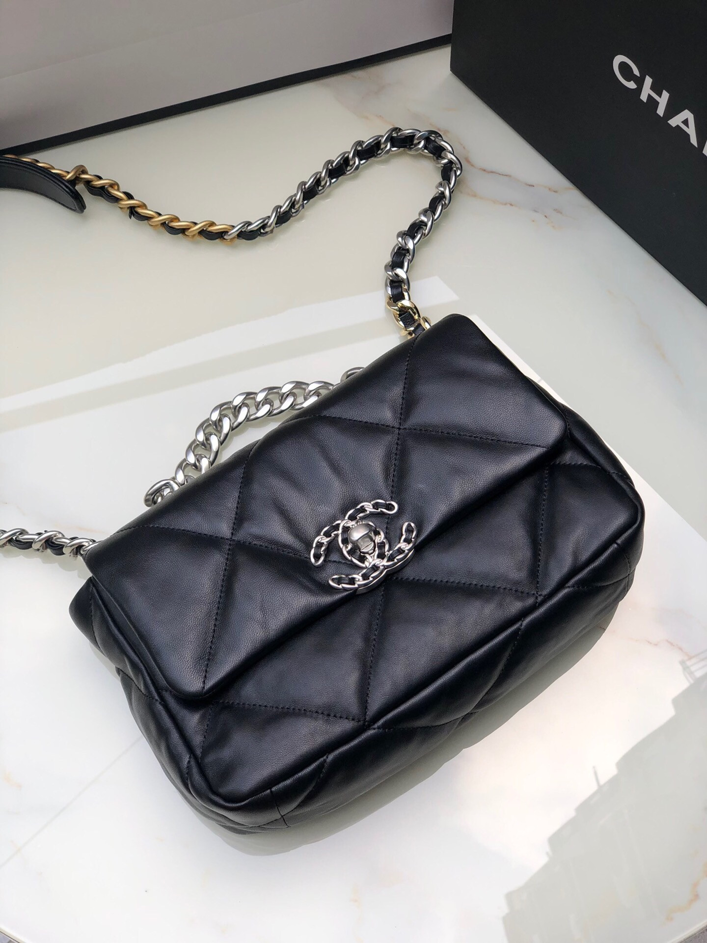 Ch*el 19 handbag shiny leather, gold-tone, silver-tone & ruthenium-finish metal black 6.2 × 10.1 × 3.5 in
