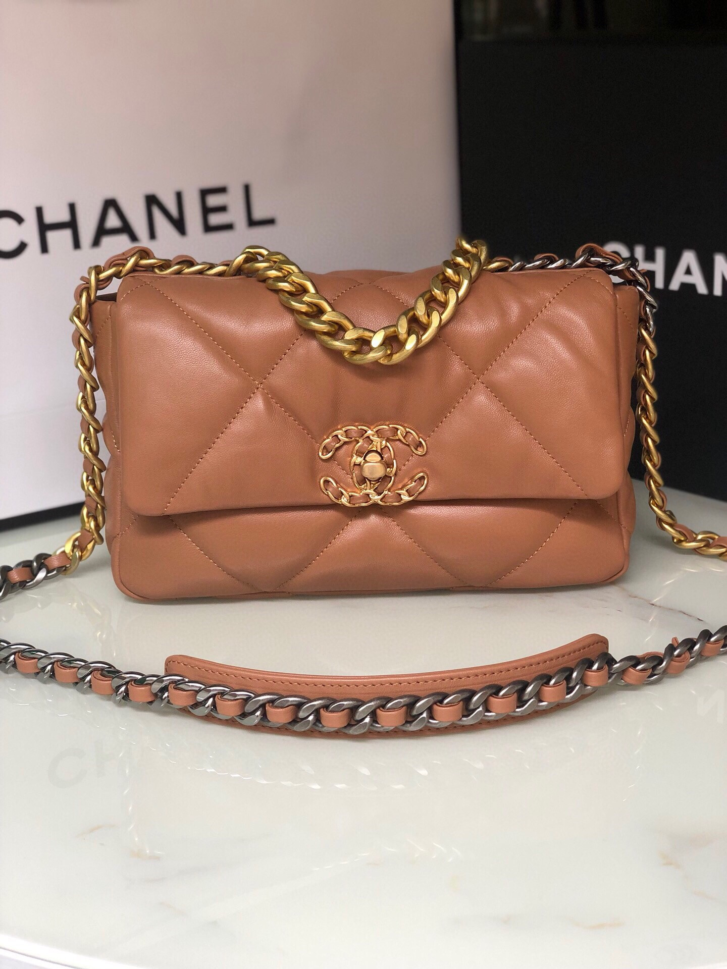 Ch*el 19 handbag shiny leather, gold-tone, silver-tone & ruthenium-finish metal caramel 6.2 × 10.1 × 3.5 in