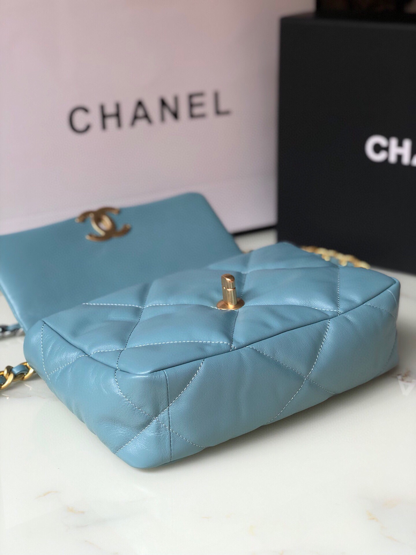 Ch*el 19 handbag shiny leather, gold-tone, silver-tone & ruthenium-finish metal blue 6.2 × 10.1 × 3.5 in