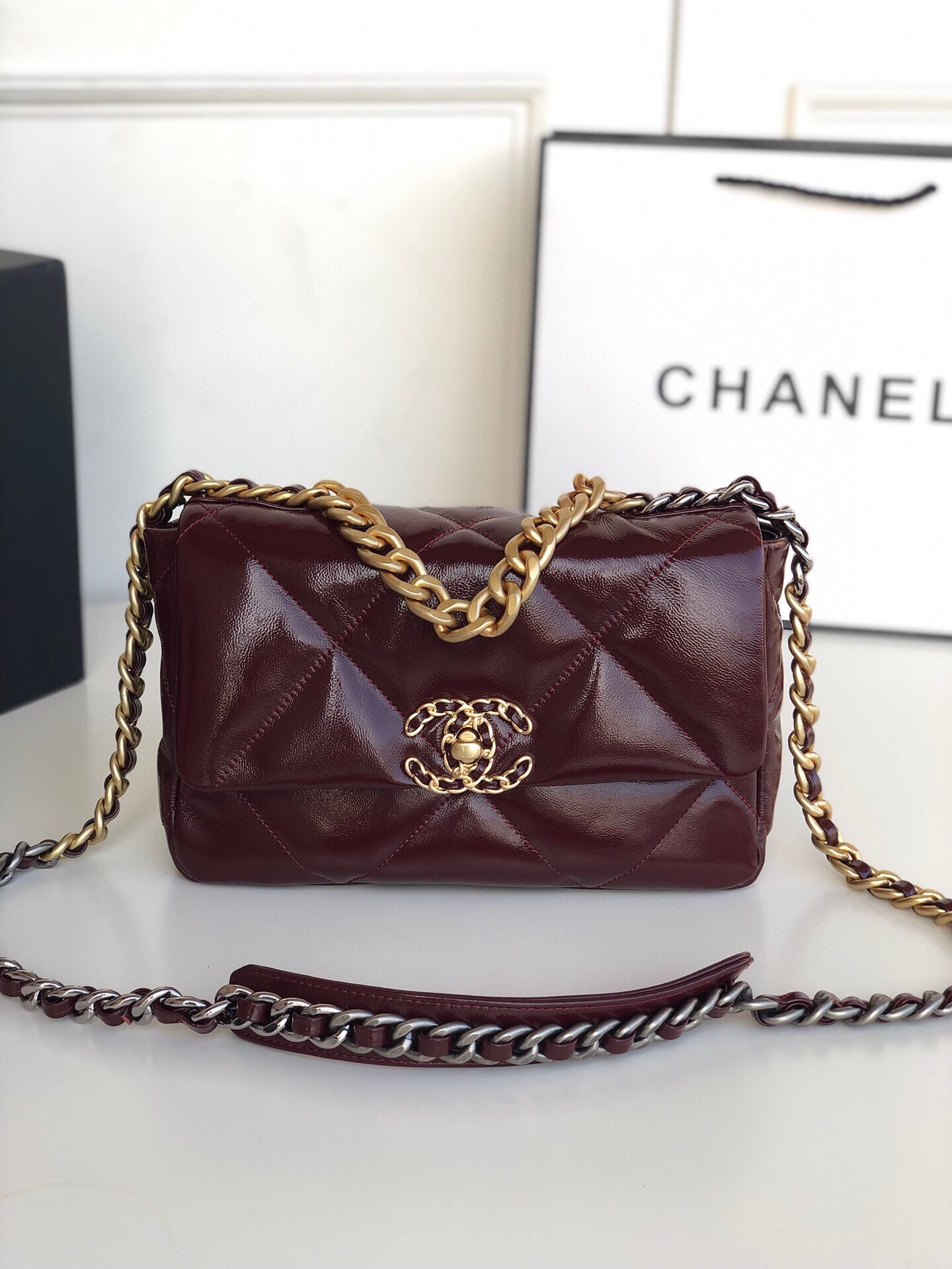 Ch*el 19 handbag shiny leather, gold-tone, silver-tone & ruthenium-finish metal dark red 6.2 × 10.1 × 3.5 in