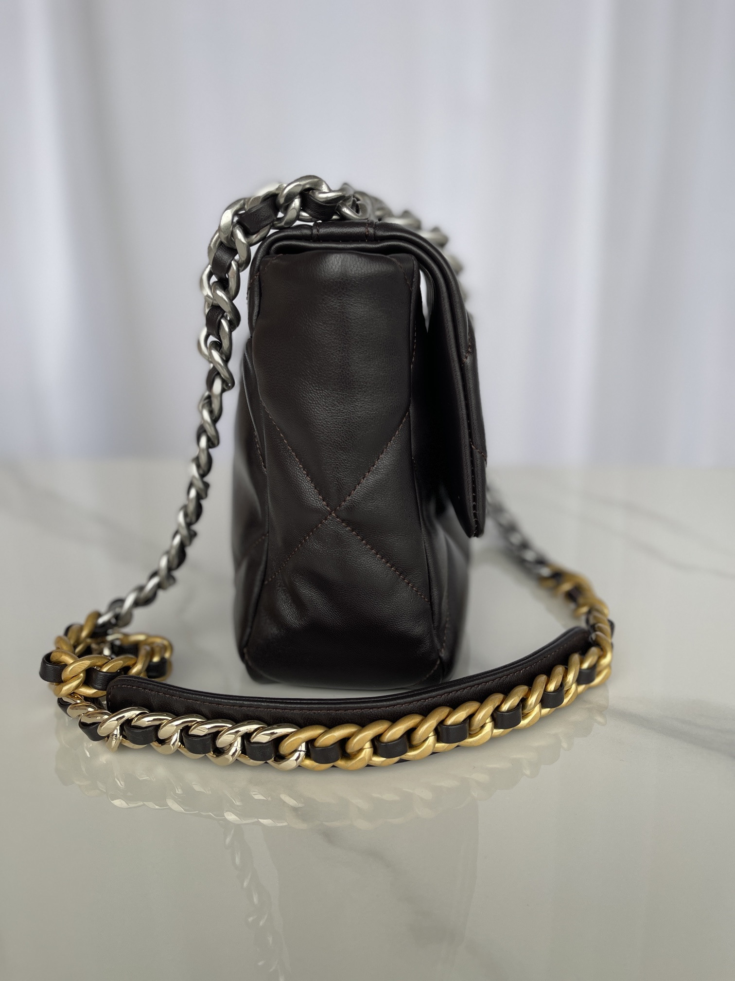 Ch*el 19 large handbag shiny leather black, gold-tone, silver-tone & ruthenium-finish metal 7.8 × 11.7 × 3.9 in