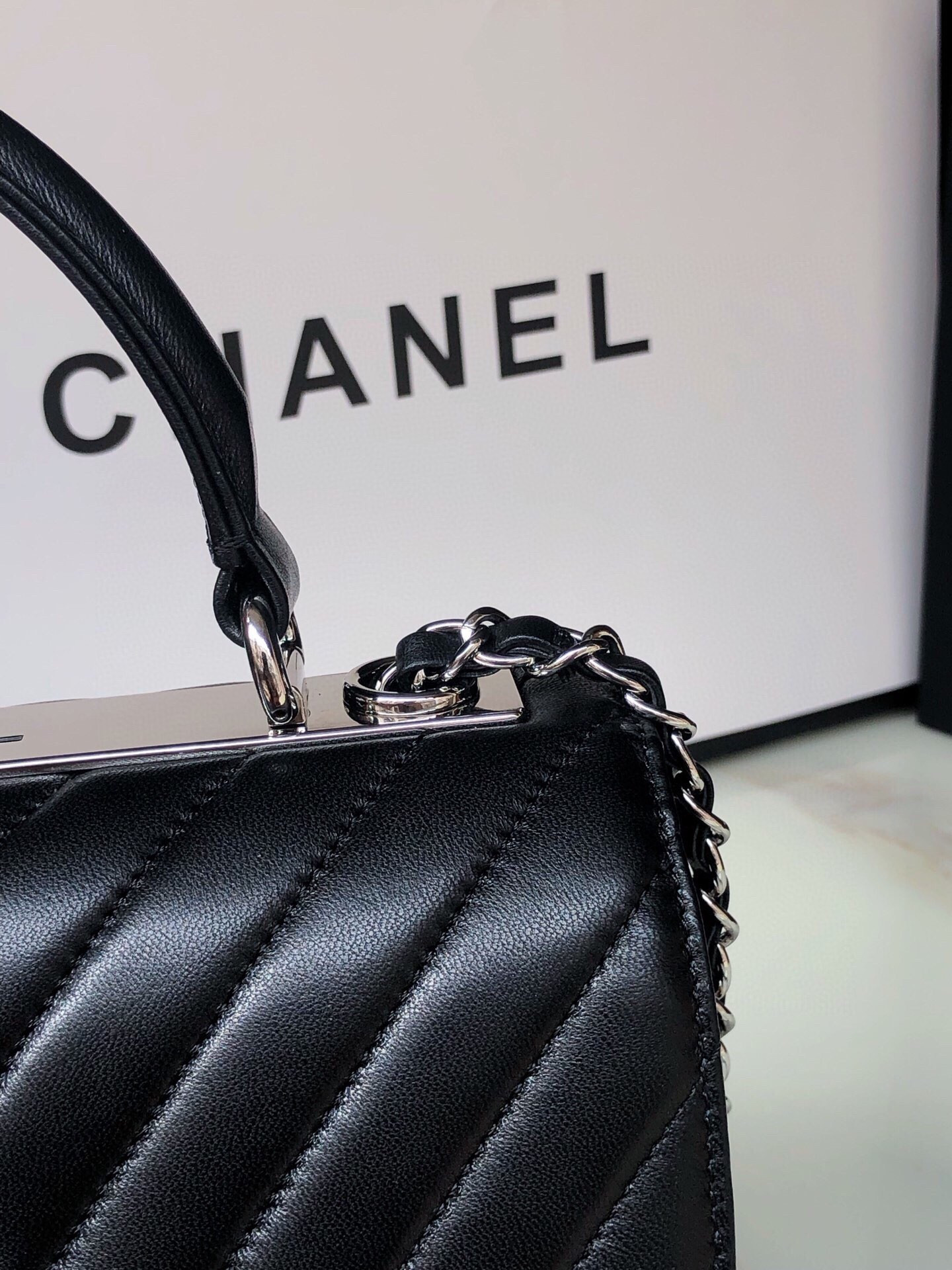 Ch*el flap bag with top handle 6.6 × 9.8 × 4.7 in